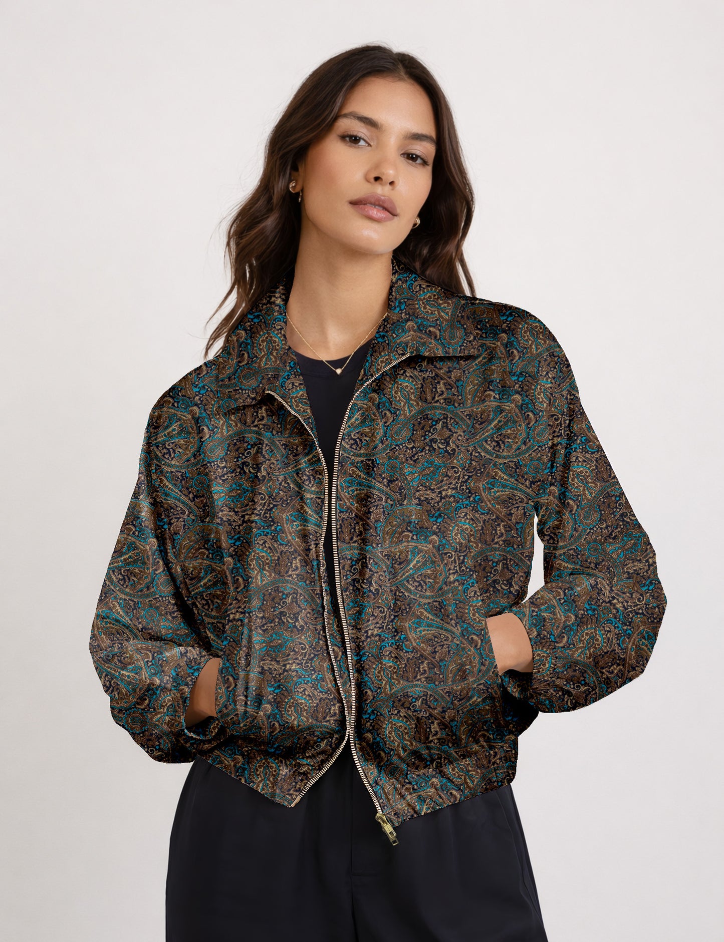 Woman wearing a yellow floral bomber jacket with front zipper, elastic cuffs, and side pockets, shown from front view
