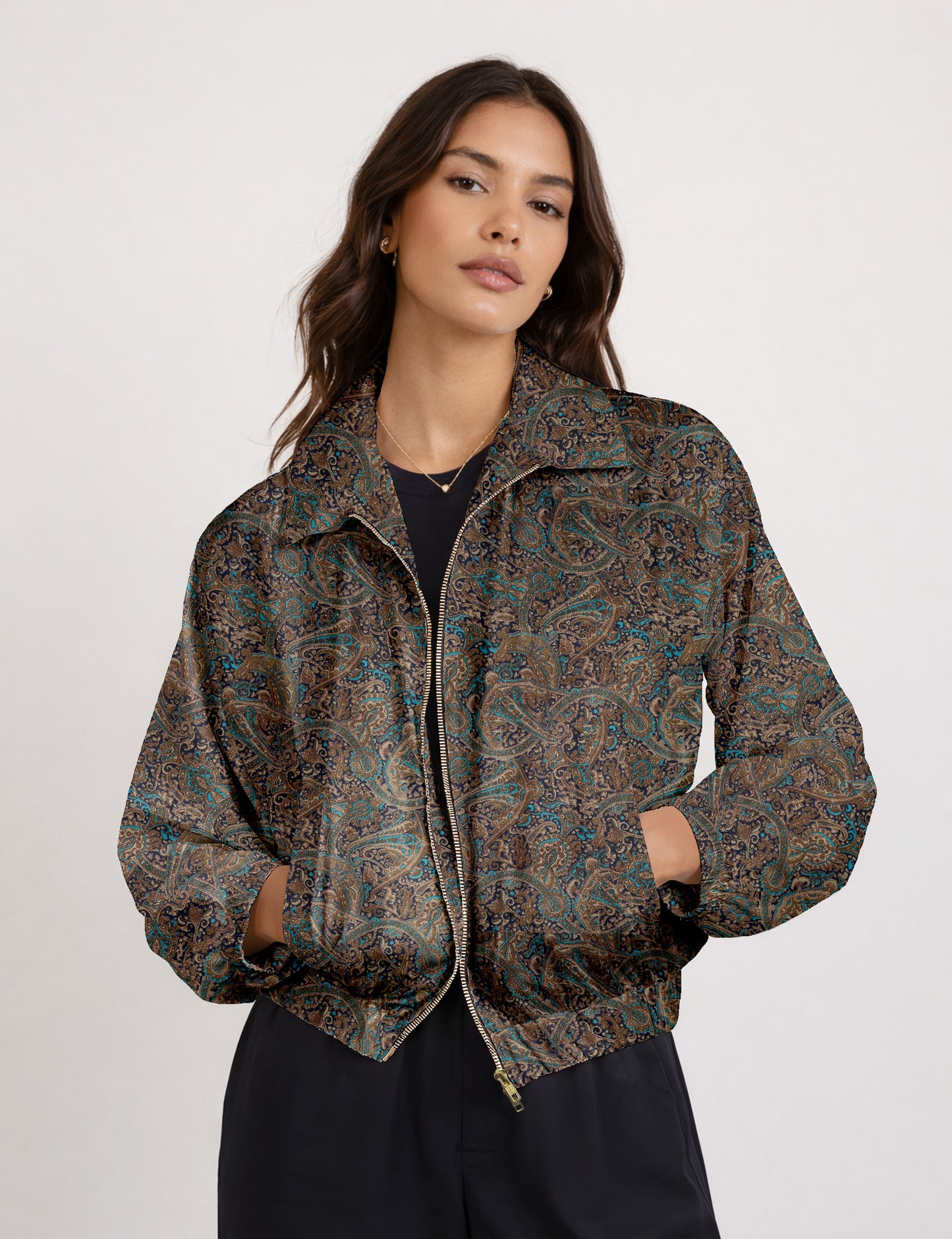 Brown floral bomber jacket with front zipper, elastic cuffs and hem, hanging on white hanger, red floral inner lining visible