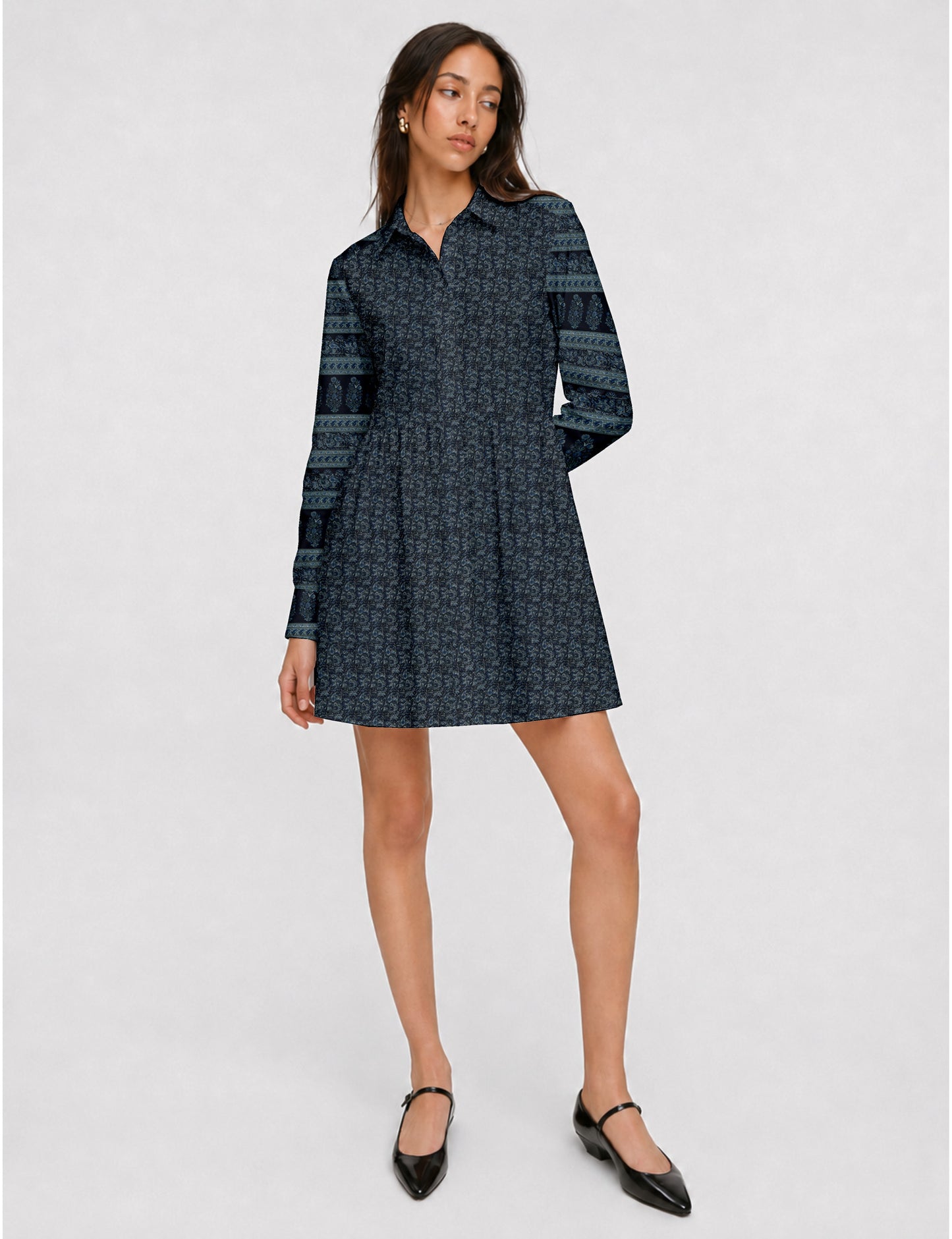 Short shirt dress with a relaxed A-line silhouette, point collar, partial button placket, gathered waist, side pockets, and full-length cuffed sleeves.
