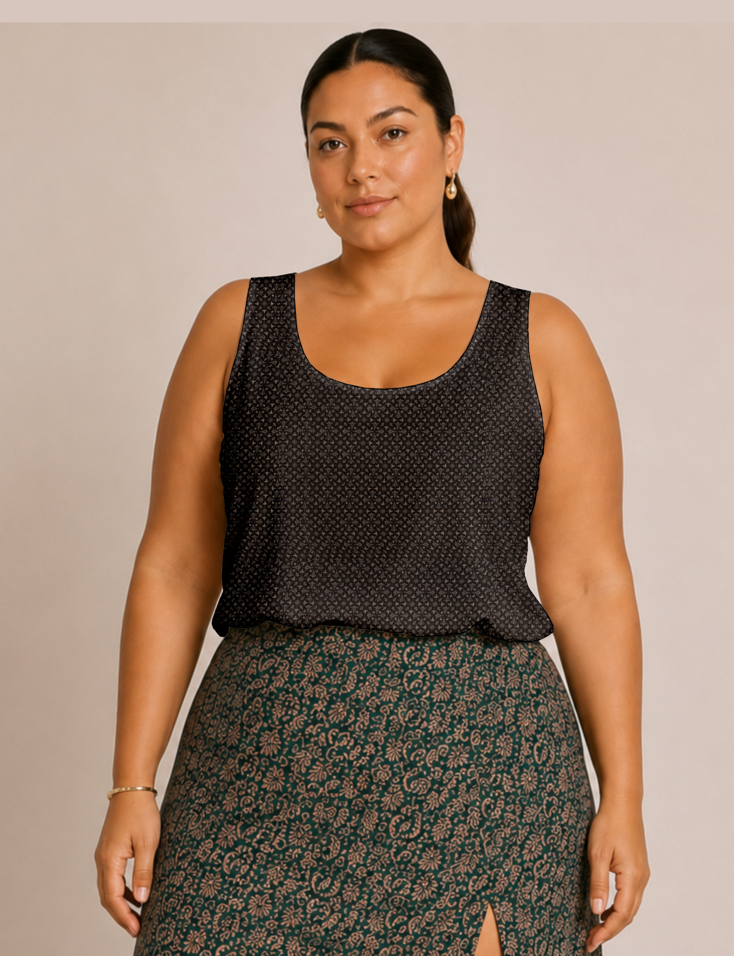 Women's sleeveless blouse with a relaxed straight fit, wide scoop neckline, deep scoop back, and hip-length silhouette.