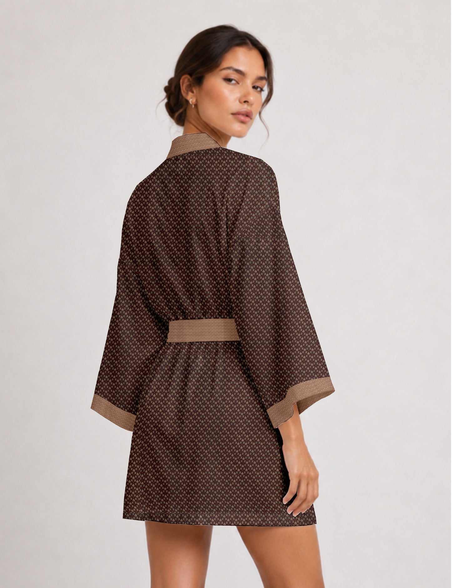 Short kimono robe with wrap front, V-neckline, wide sleeves, waist tie, and concealed skort detail.