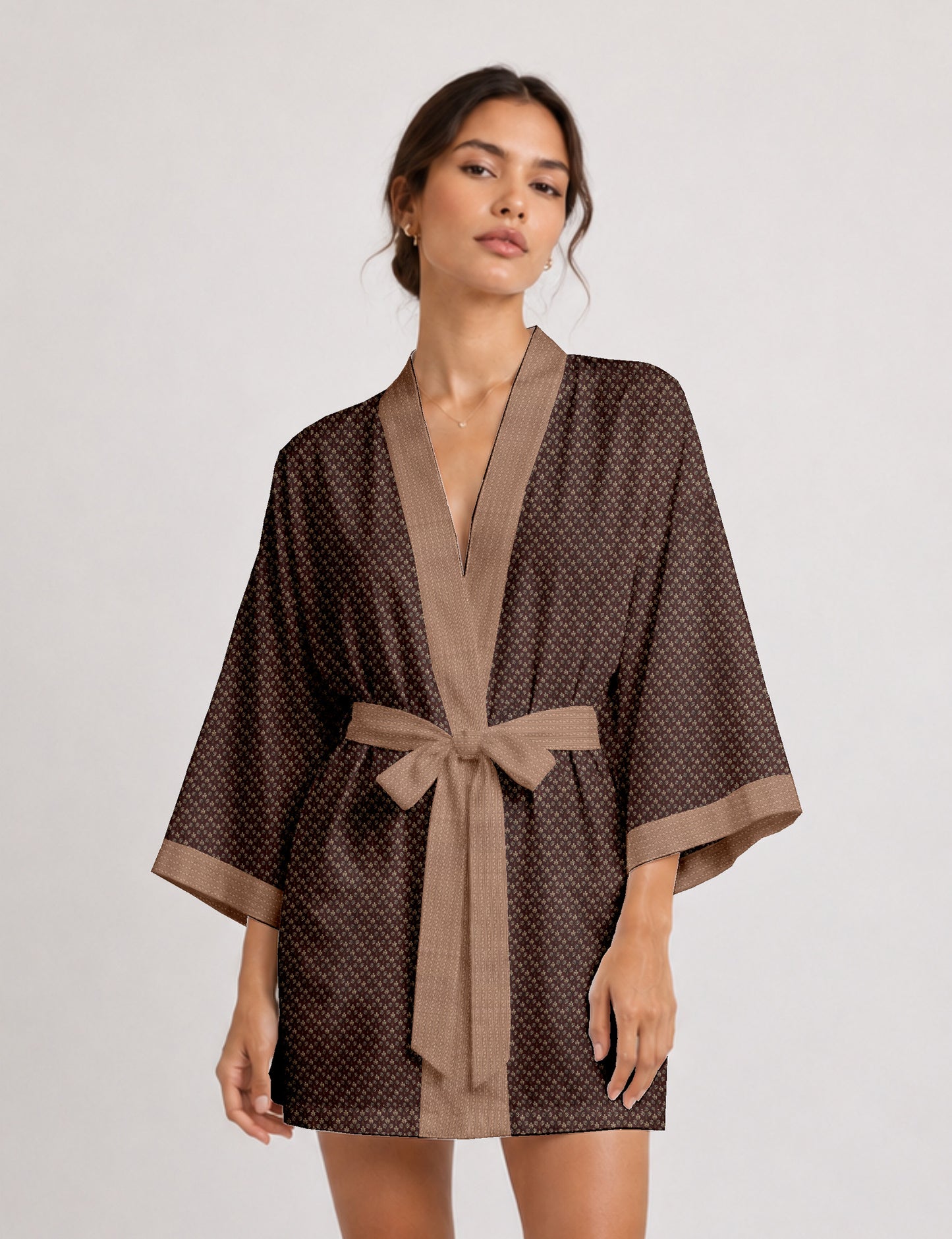 Short kimono robe with wrap front, V-neckline, wide sleeves, waist tie, and concealed skort detail.