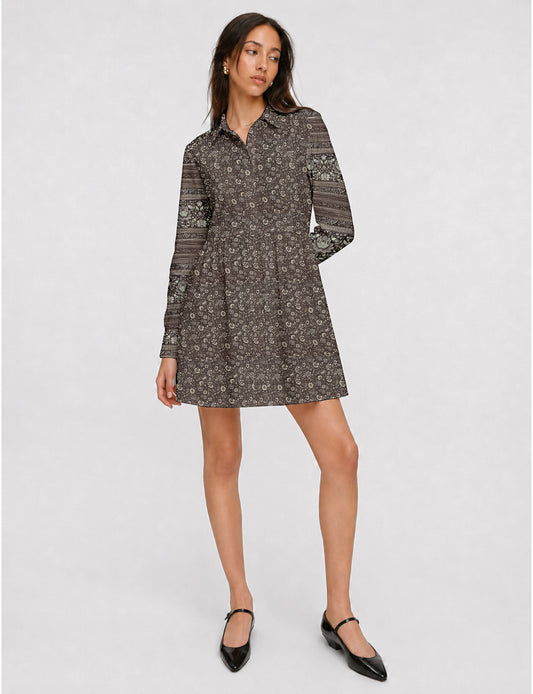 Short shirt dress with a relaxed A-line silhouette, point collar, partial button placket, gathered waist, side pockets, and full-length cuffed sleeves.