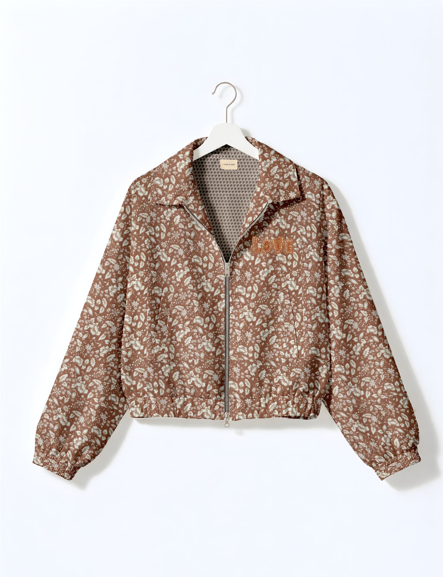 Love Bomber Jacket made from recycled fabric, featuring hand-stitched Aari embroidery. A unique piece of zero-waste clothing, part of the circular fashion movement. Designed with upcycled materials for a stylish yet environmentally friendly clothing choice.