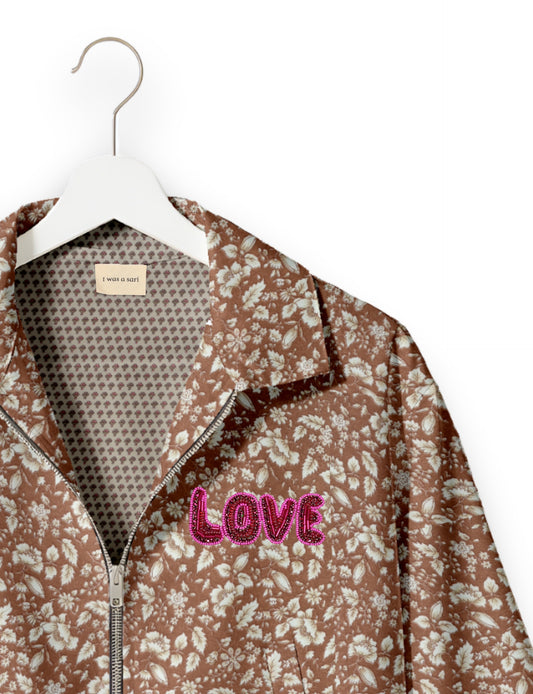 Love Bomber Jacket made from recycled fabric, featuring hand-stitched Aari embroidery. A unique piece of zero-waste clothing, part of the circular fashion movement. Designed with upcycled materials for a stylish yet environmentally friendly clothing choice.