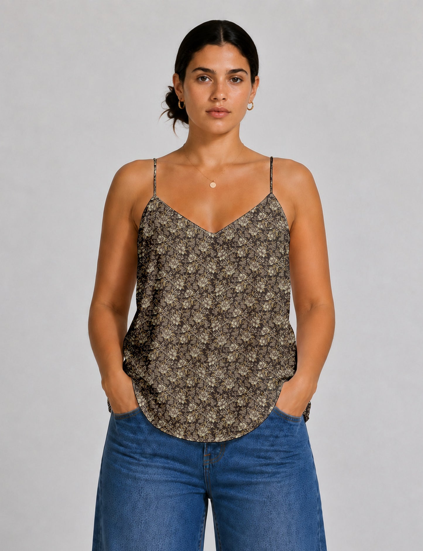 Women's sleeveless slip top with a relaxed straight fit, soft V-neckline, deep V-back, and delicate spaghetti straps.