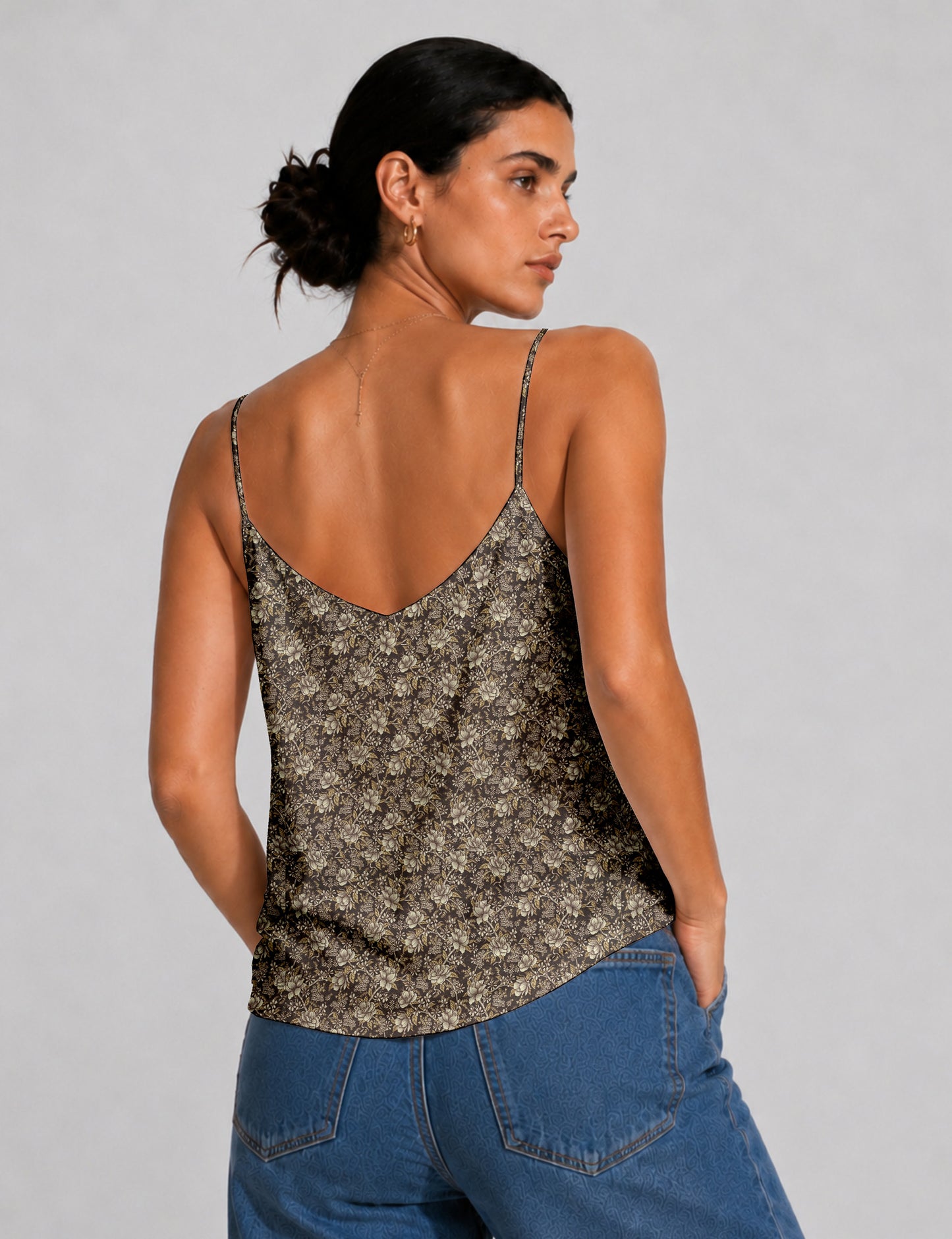 Women's sleeveless slip top with a relaxed straight fit, soft V-neckline, deep V-back, and delicate spaghetti straps.