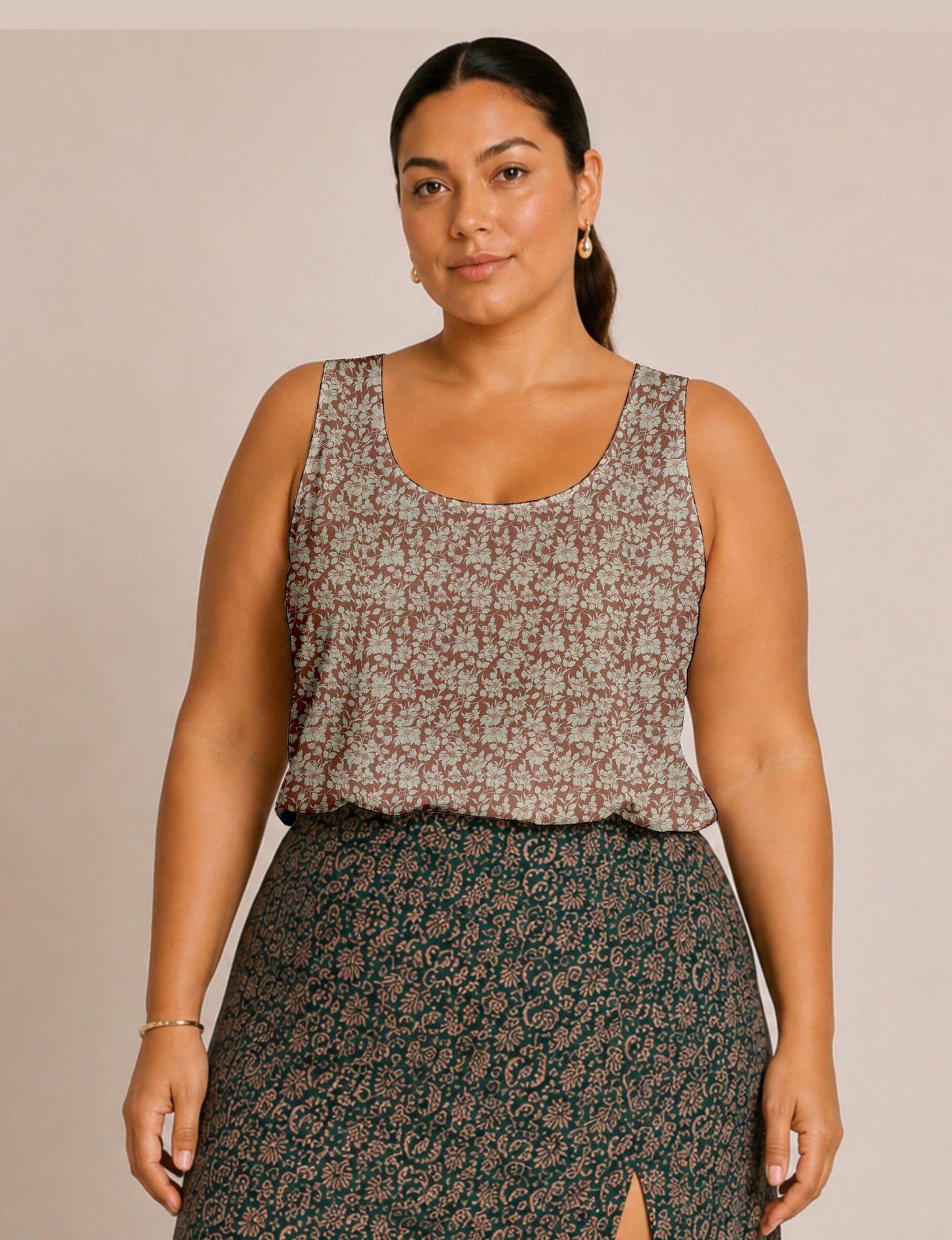 Women's sleeveless blouse with a relaxed straight fit, wide scoop neckline, deep scoop back, and hip-length silhouette.