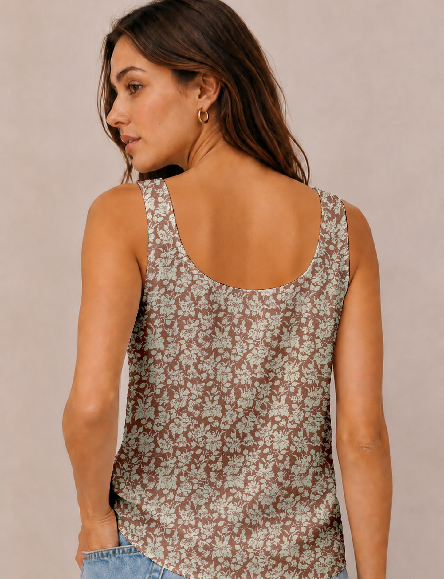 Women's sleeveless blouse with a relaxed straight fit, wide scoop neckline, deep scoop back, and hip-length silhouette.