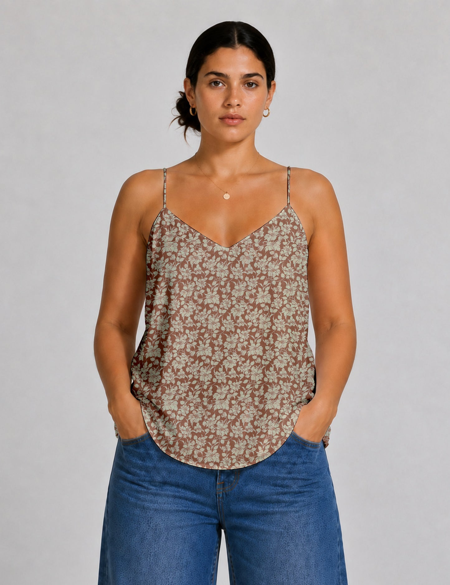 Women's sleeveless slip top with a relaxed straight fit, soft V-neckline, deep V-back, and delicate spaghetti straps.