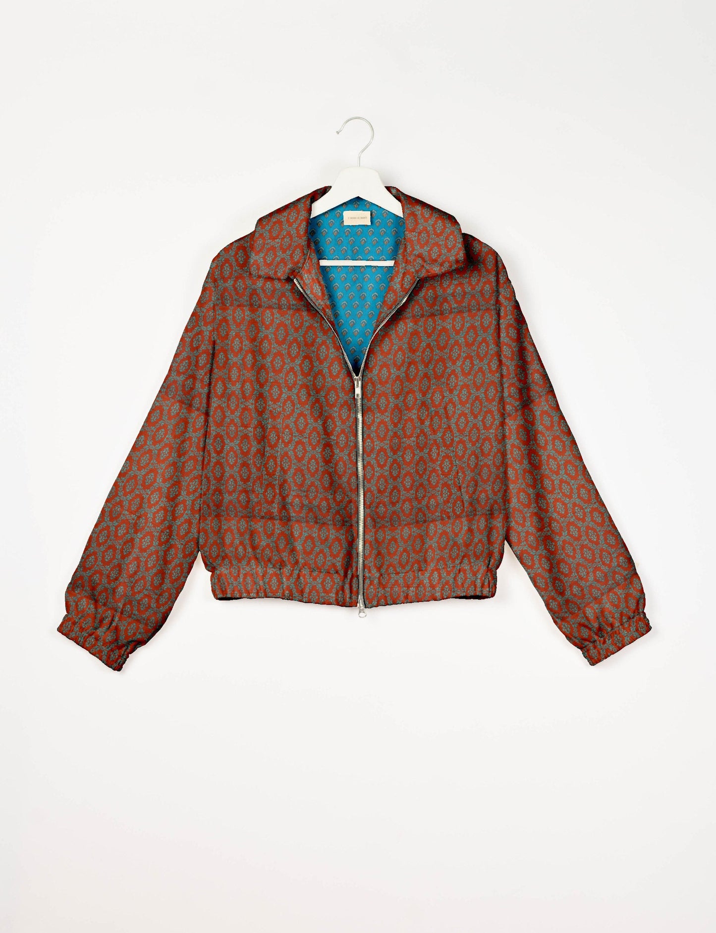 Upcycled Bomber Jacket made from recycled sari materials, featuring a cute cropped shape, elasticated hem and cuffs, and contrast sari print lining. Sustainable apparel promoting eco-friendly fashion and ethical clothing.