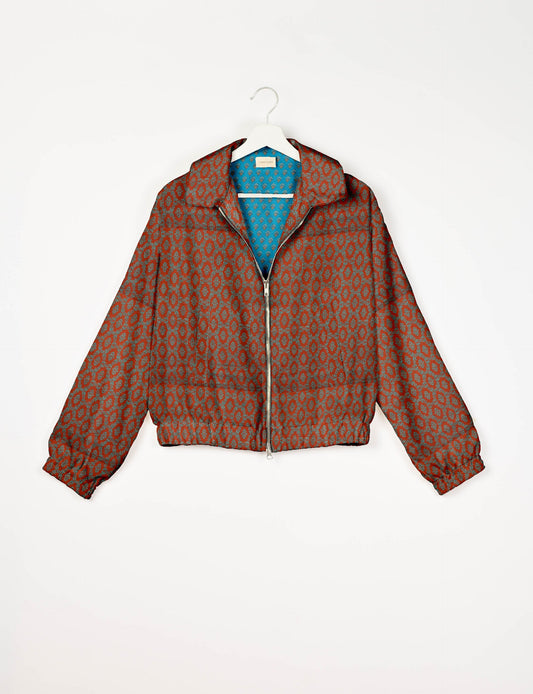 Upcycled Bomber Jacket made from recycled sari materials, featuring a cute cropped shape, elasticated hem and cuffs, and contrast sari print lining. Sustainable apparel promoting eco-friendly fashion and ethical clothing.