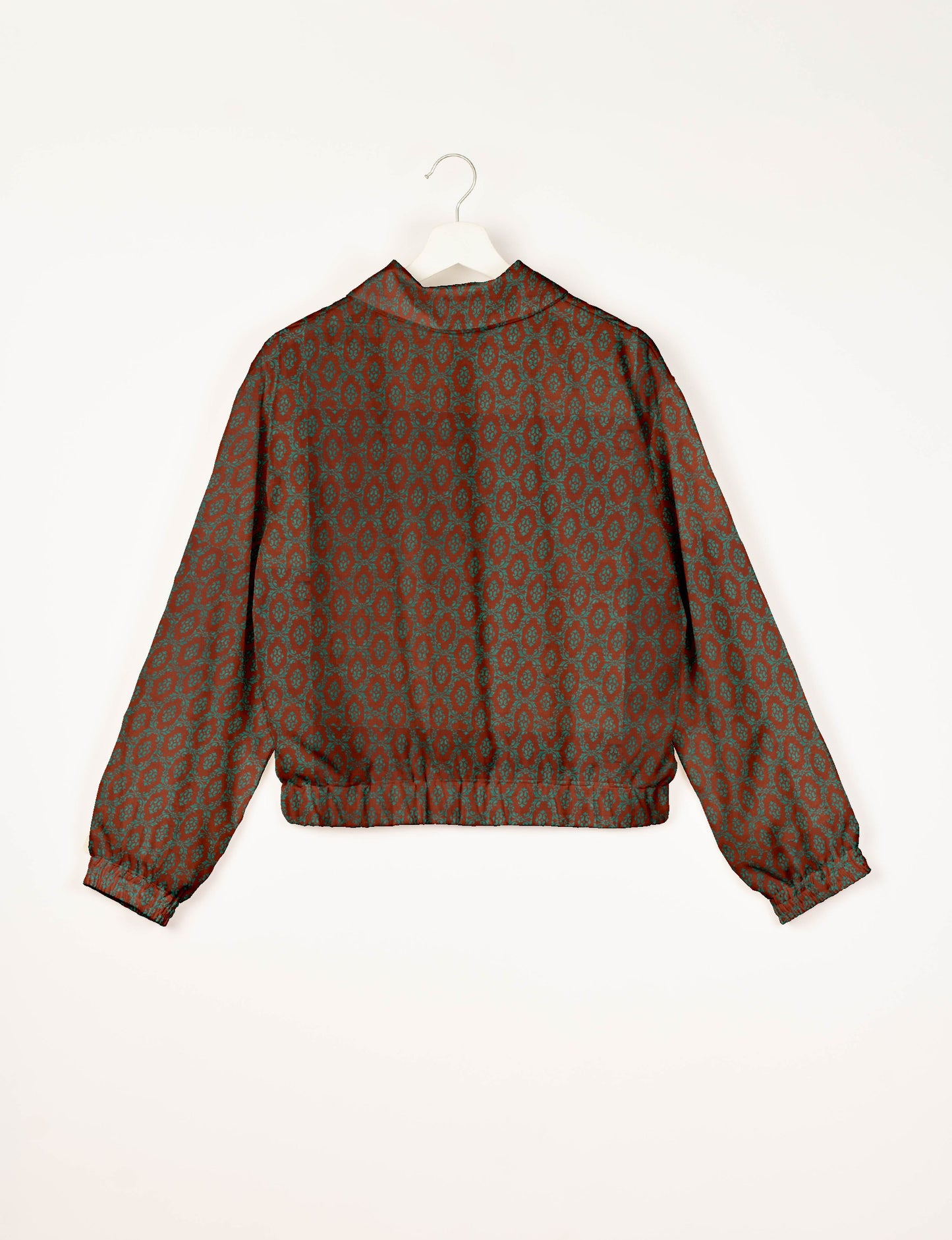 Brown bomber jacket with teal Indian ethnic pattern, elastic cuffs and waistband, shown from back on white hanger