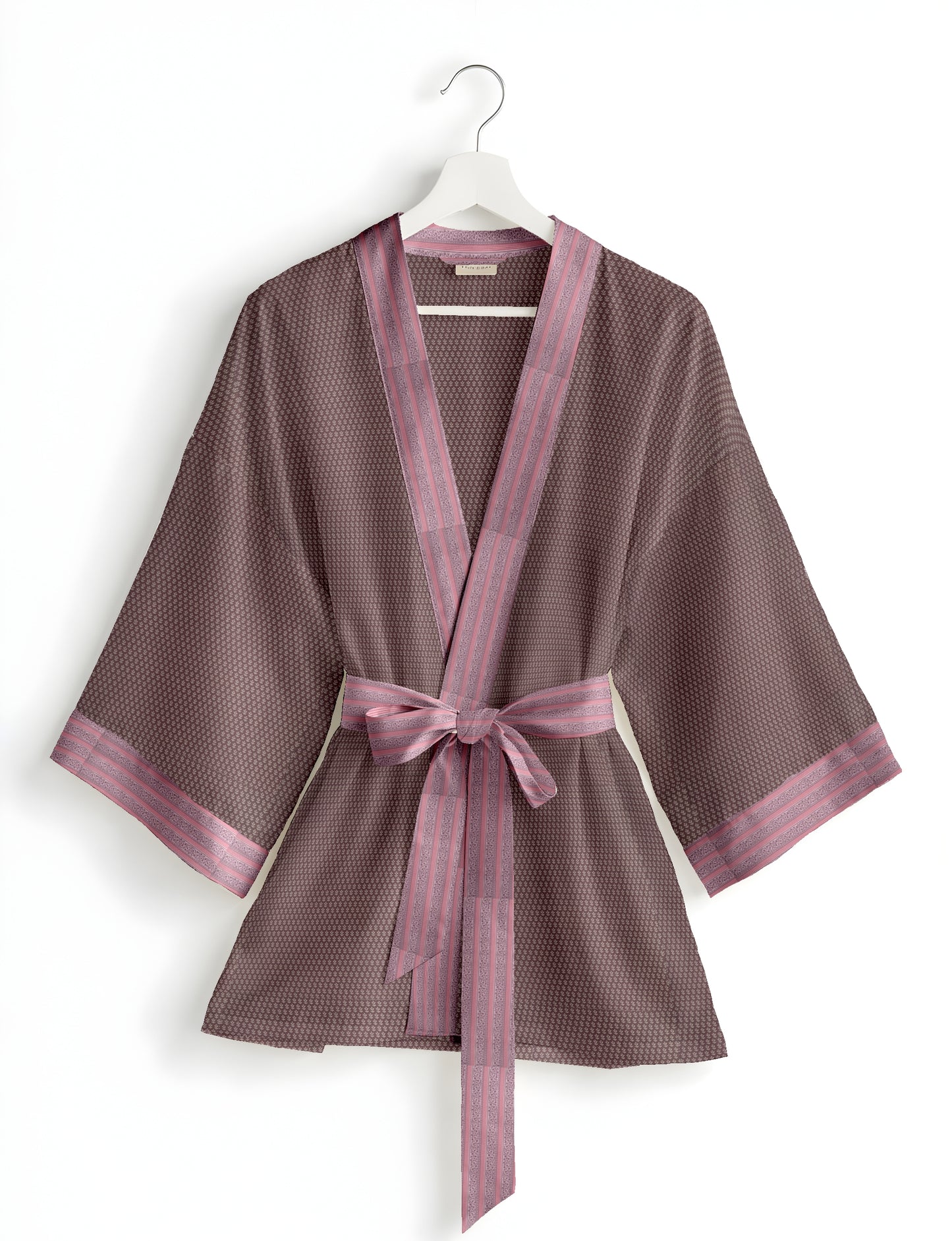 Short kimono robe with wrap front, V-neckline, wide sleeves, waist tie, and concealed skort detail.
