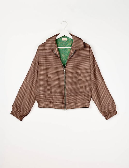 Upcycled Bomber Jacket made from recycled sari materials, featuring a cute cropped shape, elasticated hem and cuffs, and contrast sari print lining. Sustainable apparel promoting eco-friendly fashion and ethical clothing.