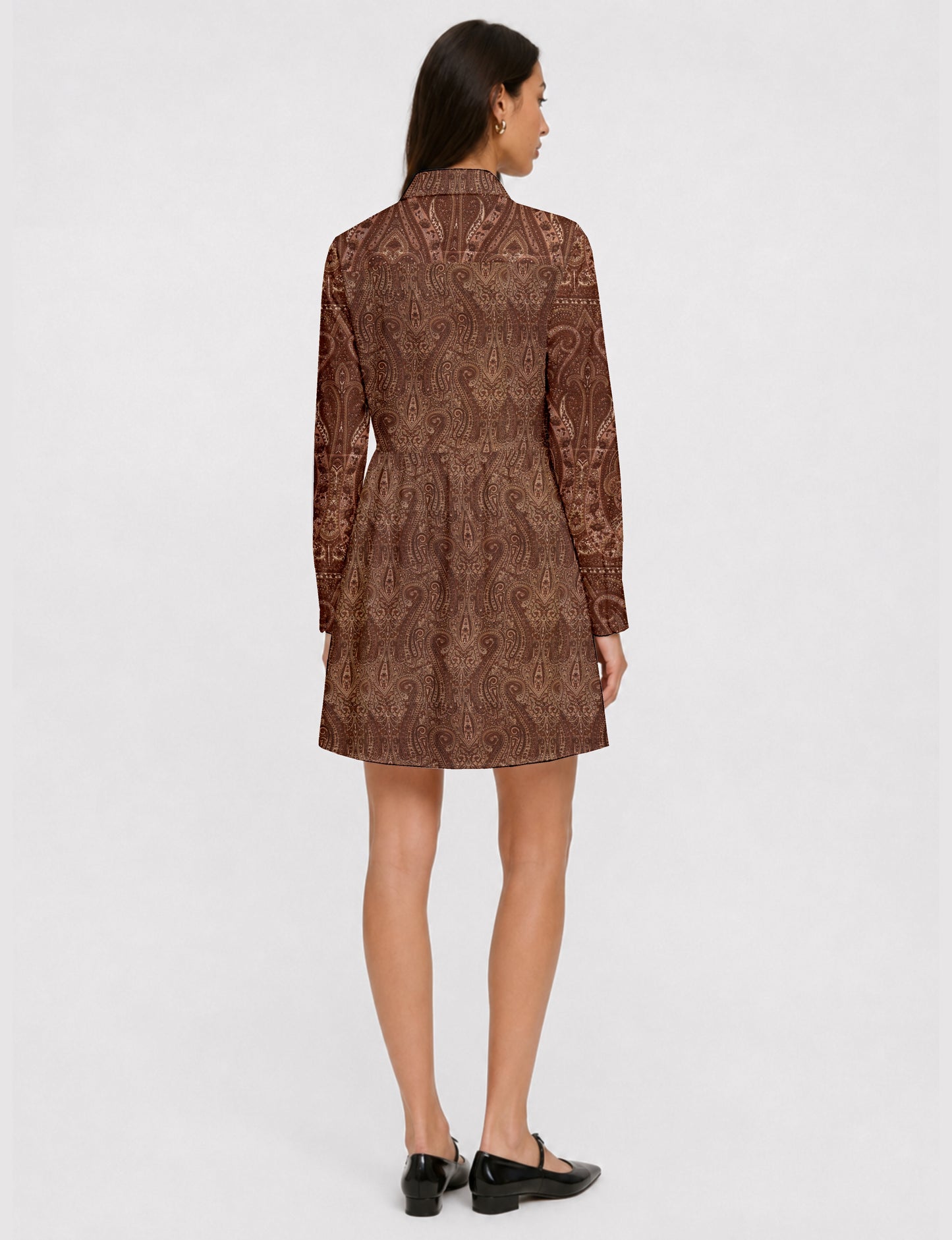 Short shirt dress with a relaxed A-line silhouette, point collar, partial button placket, gathered waist, side pockets, and full-length cuffed sleeves.