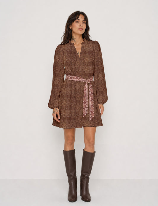 Swing dress with detachable tie belt, gathered ruffle neckline, full-length voluminous sleeves, elastic cuffs, and relaxed A-line silhouette in an above-knee length.