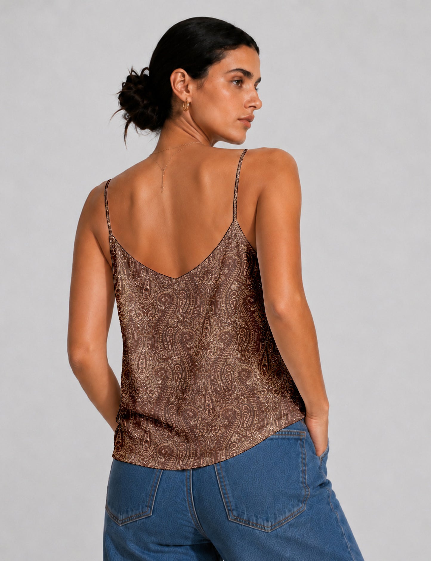 Women's sleeveless slip top with a relaxed straight fit, soft V-neckline, deep V-back, and delicate spaghetti straps.