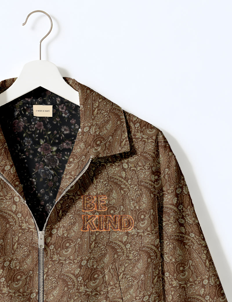BE KIND Bomber jacket made from upcycled sari fabric with handcrafted Aari embroidery by female artisans.