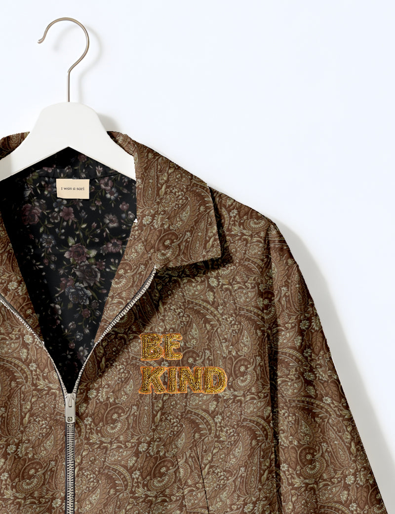 BE KIND Bomber jacket made from upcycled sari fabric with handcrafted Aari embroidery by female artisans.