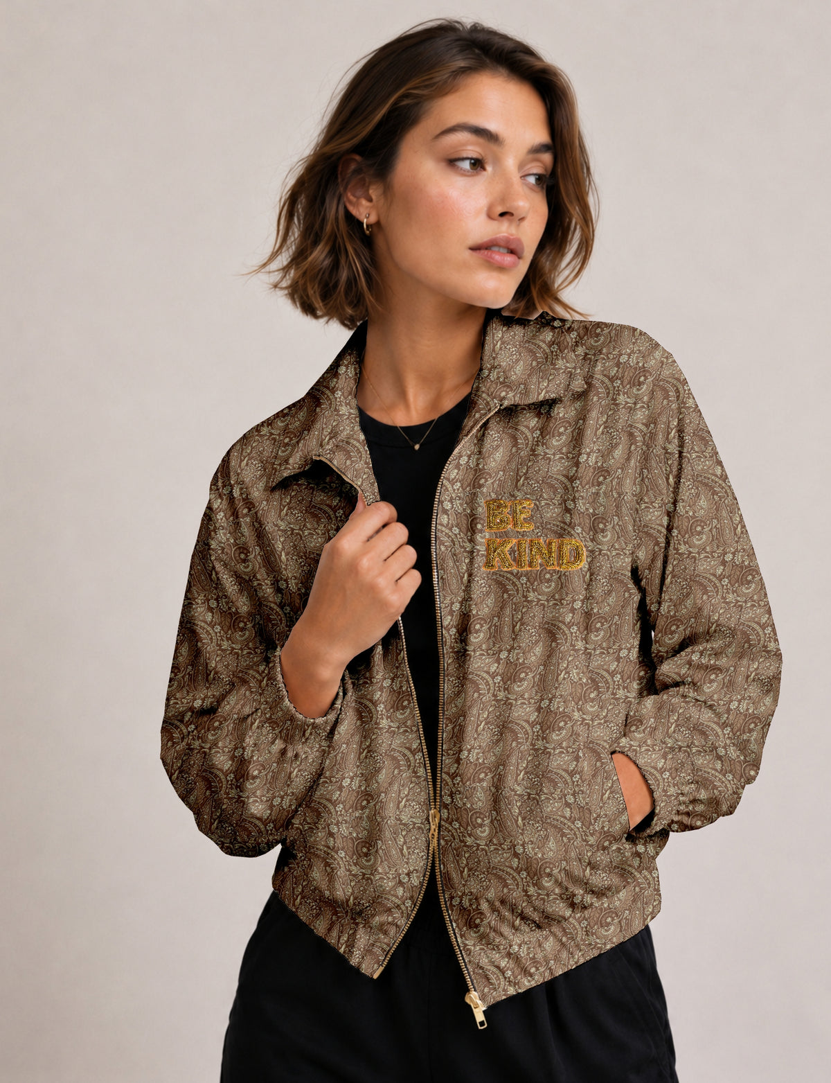 BE KIND Bomber jacket made from upcycled sari fabric with handcrafted Aari embroidery by female artisans.