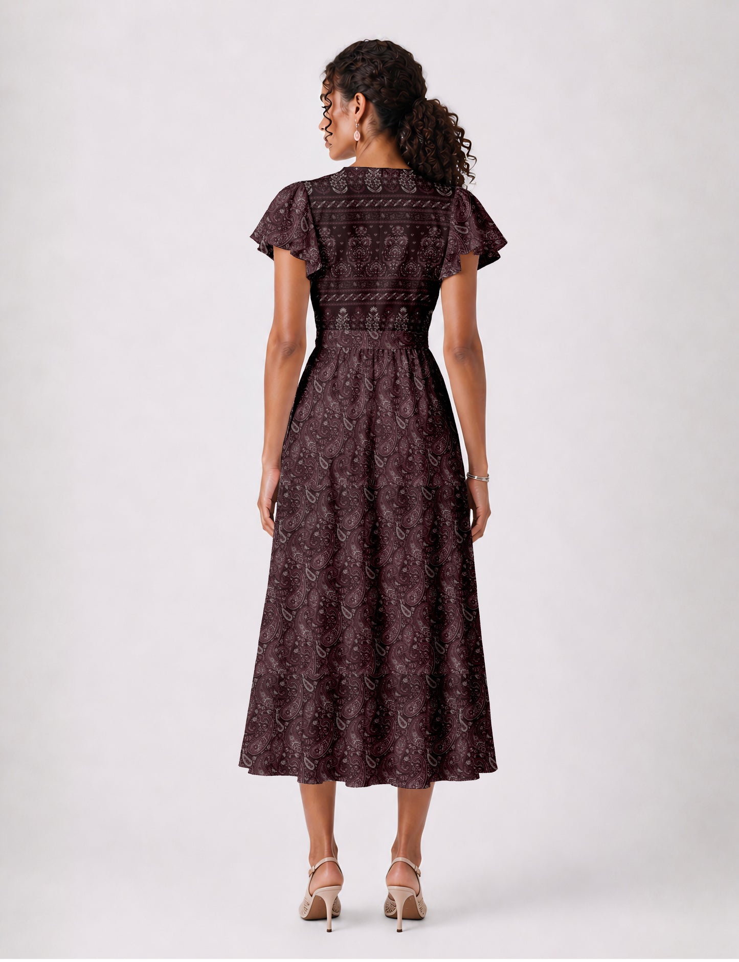 Midi wrap dress with V-neckline, fitted bodice, tie waist, and flared mid-calf skirt
