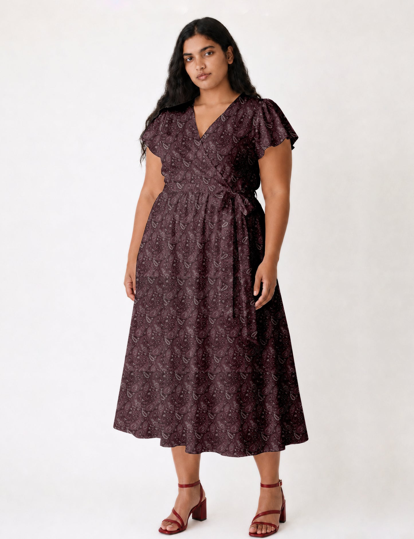 Midi wrap dress with V-neckline, fitted bodice, tie waist, and flared mid-calf skirt