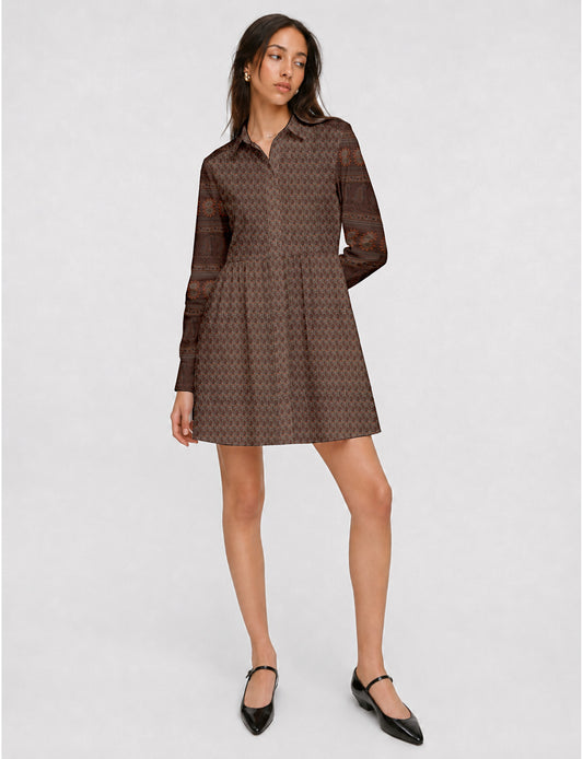 Short shirt dress with a relaxed A-line silhouette, point collar, partial button placket, gathered waist, side pockets, and full-length cuffed sleeves.