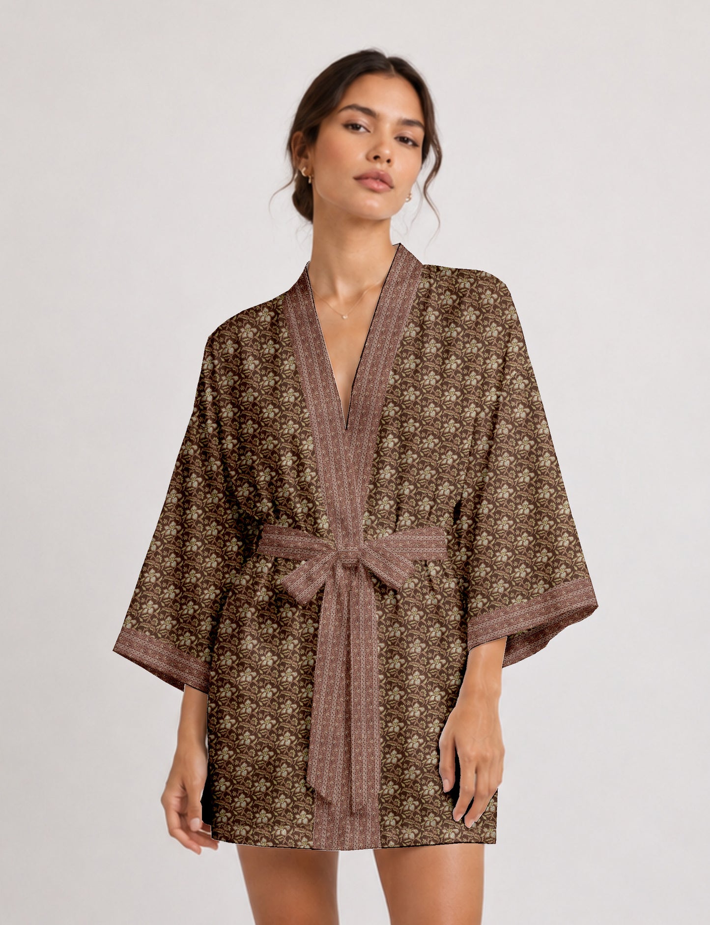 Short kimono robe with wrap front, V-neckline, wide sleeves, waist tie, and concealed skort detail.