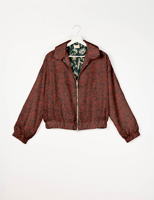 Upcycled Bomber Jacket made from recycled sari materials, featuring a cute cropped shape, elasticated hem and cuffs, and contrast sari print lining. Sustainable apparel promoting eco-friendly fashion and ethical clothing.