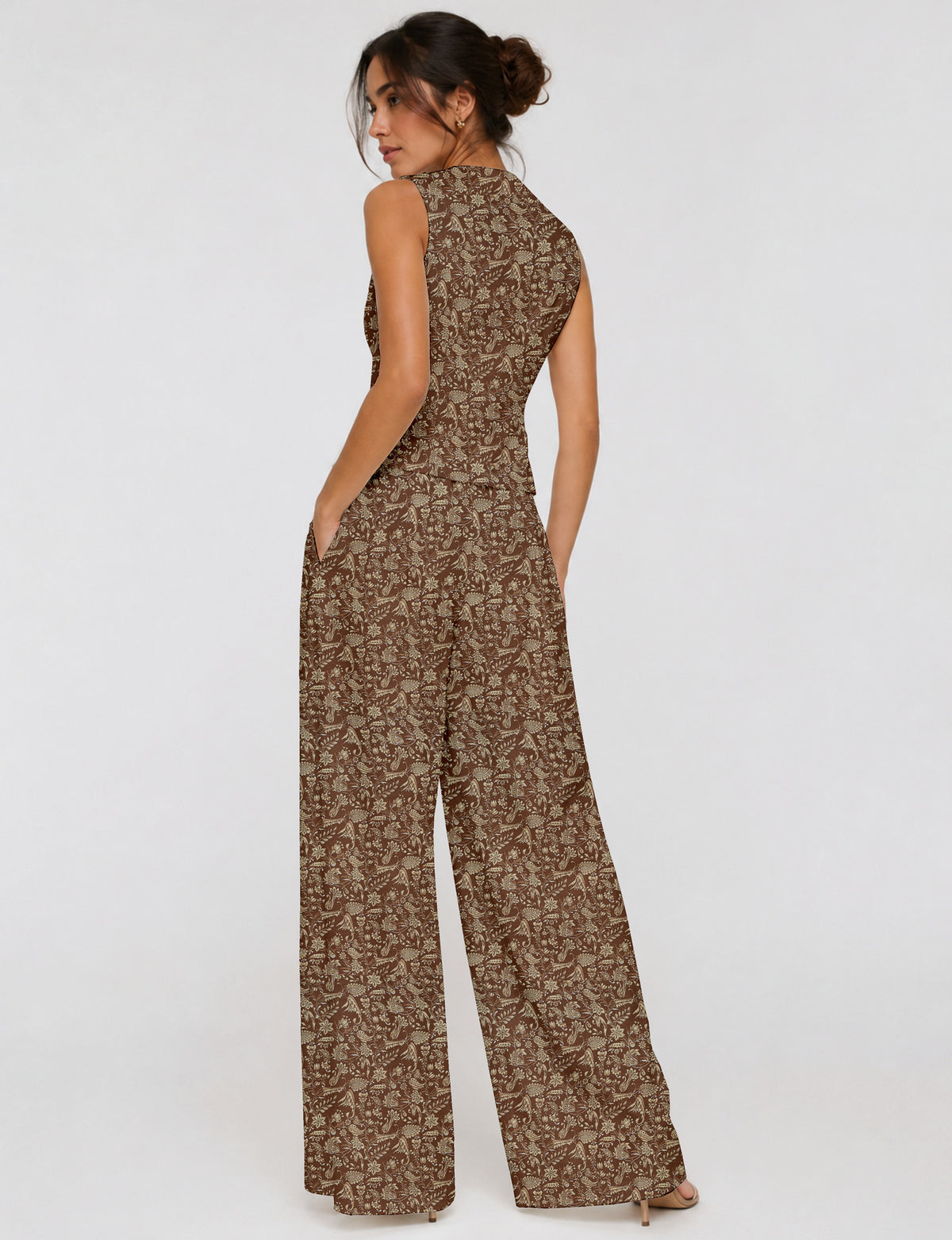 Women's tailored waistcoat set with a sleeveless V-neck button-front waistcoat and high-rise wide leg trousers in a coordinated matching outfit.