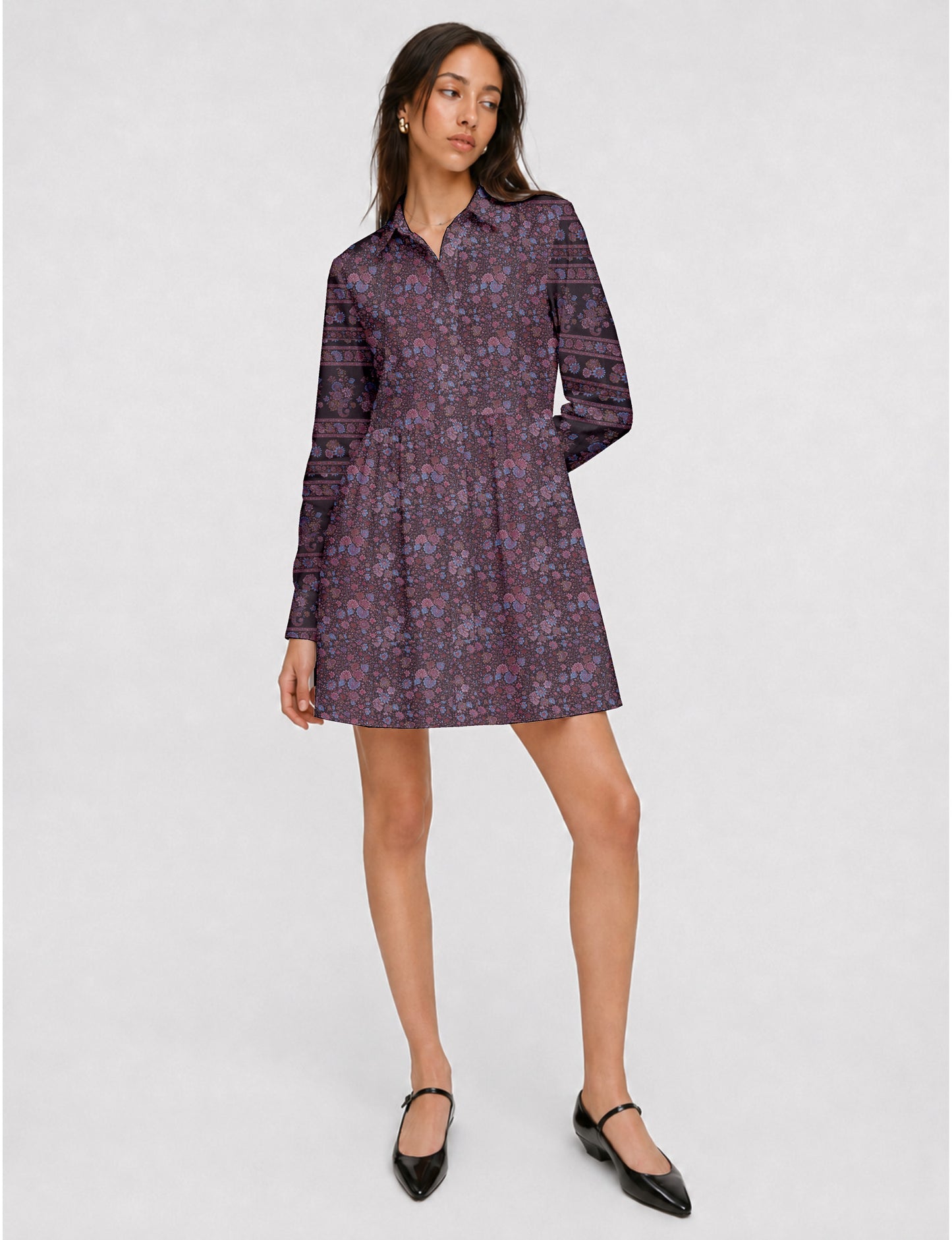 Short shirt dress with a relaxed A-line silhouette, point collar, partial button placket, gathered waist, side pockets, and full-length cuffed sleeves.