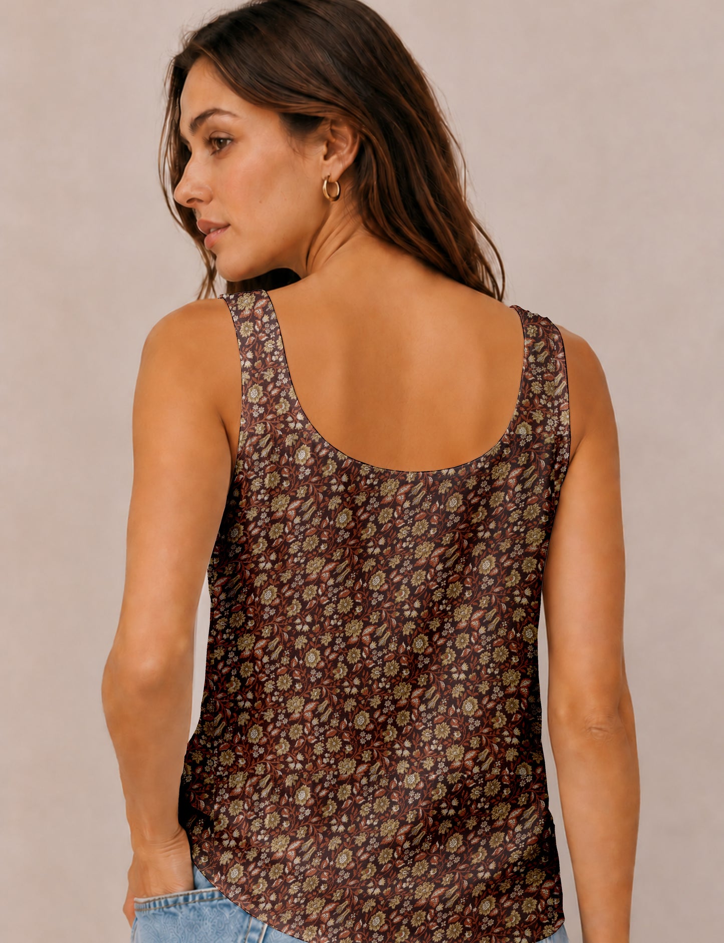Women's sleeveless blouse with a relaxed straight fit, wide scoop neckline, deep scoop back, and hip-length silhouette.