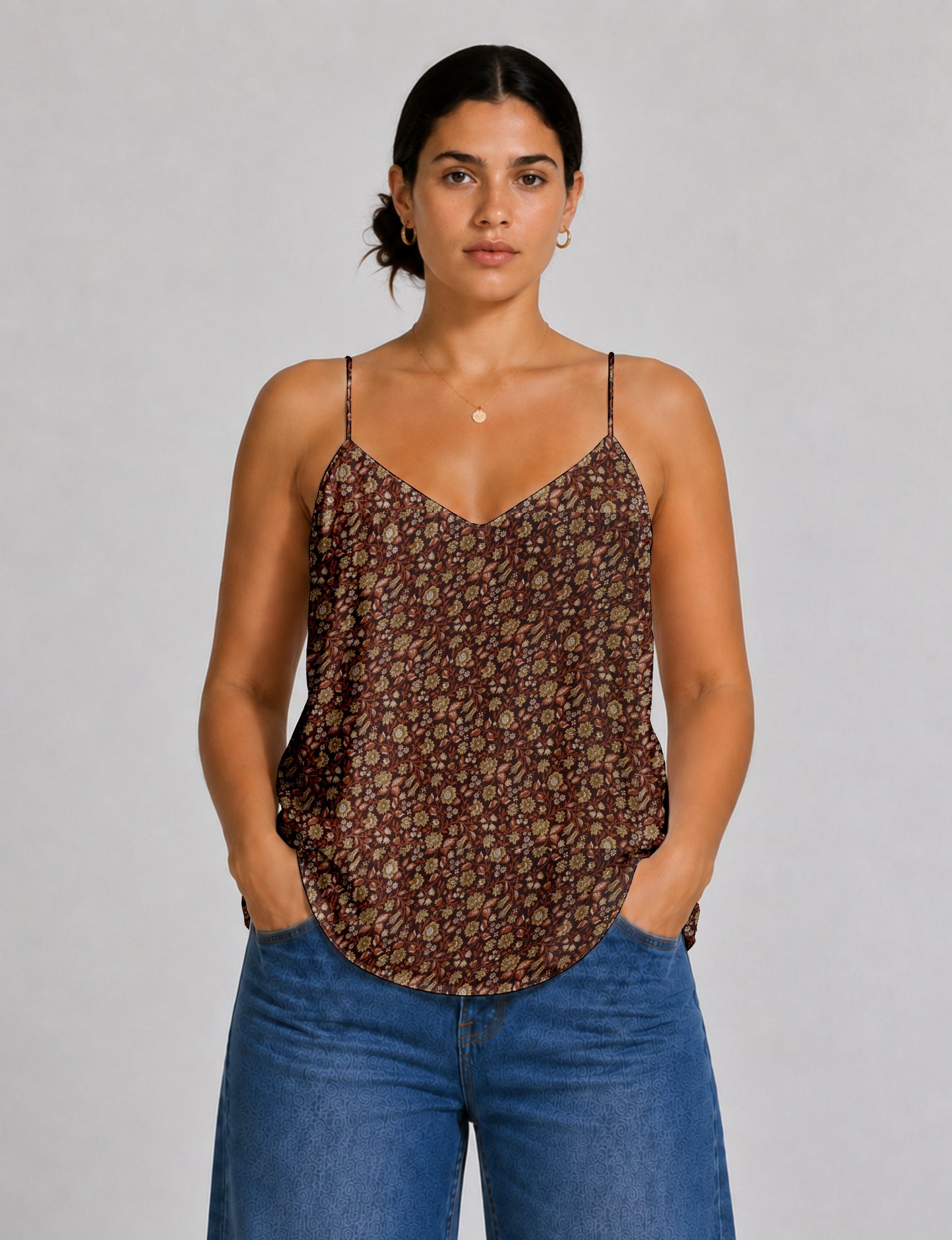 Women's sleeveless slip top with a relaxed straight fit, soft V-neckline, deep V-back, and delicate spaghetti straps.
