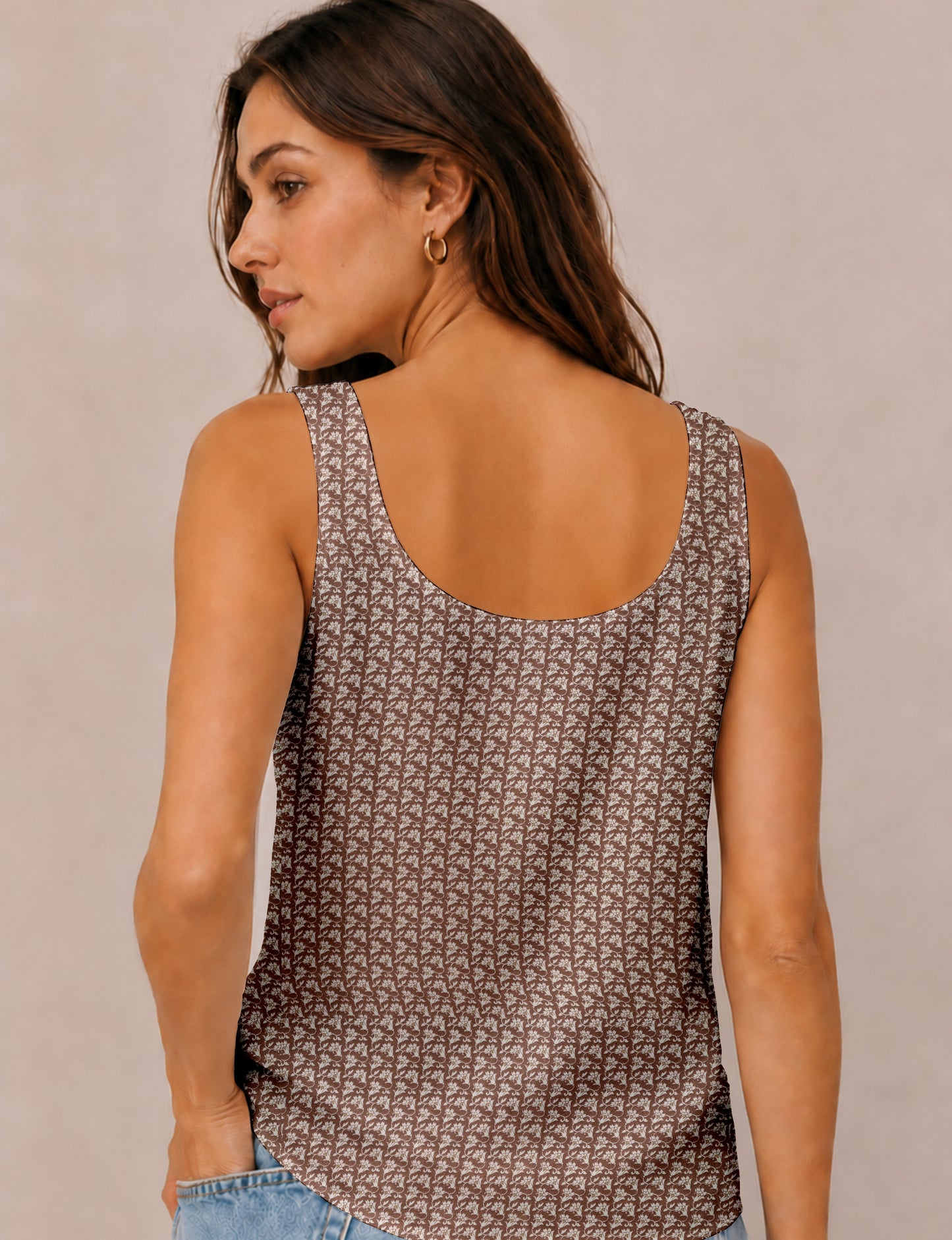 Women's sleeveless blouse with a relaxed straight fit, wide scoop neckline, deep scoop back, and hip-length silhouette.