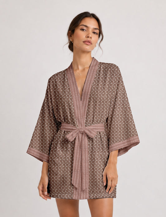 Short kimono robe with wrap front, V-neckline, wide sleeves, waist tie, and concealed skort detail.