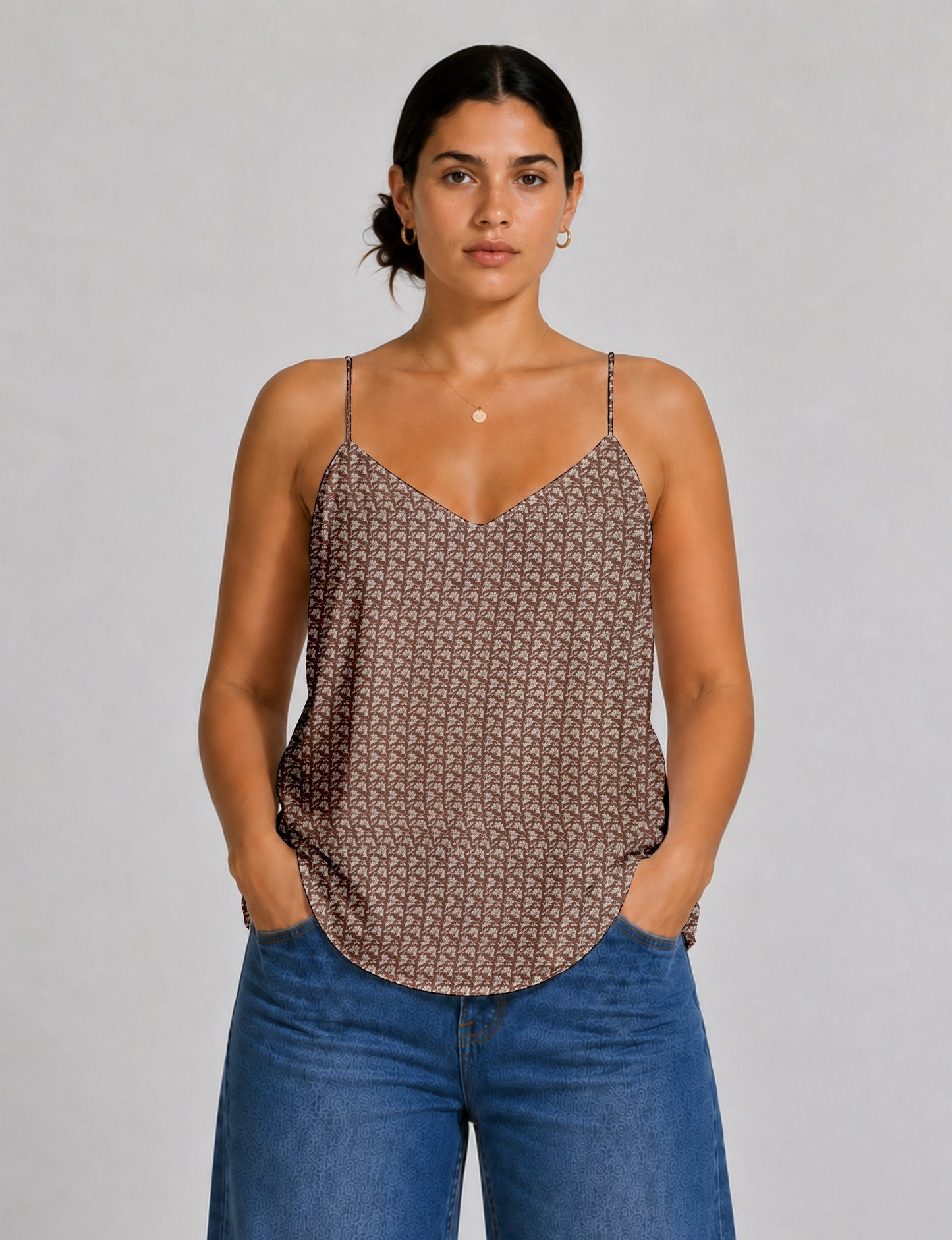 Women's sleeveless slip top with a relaxed straight fit, soft V-neckline, deep V-back, and delicate spaghetti straps.