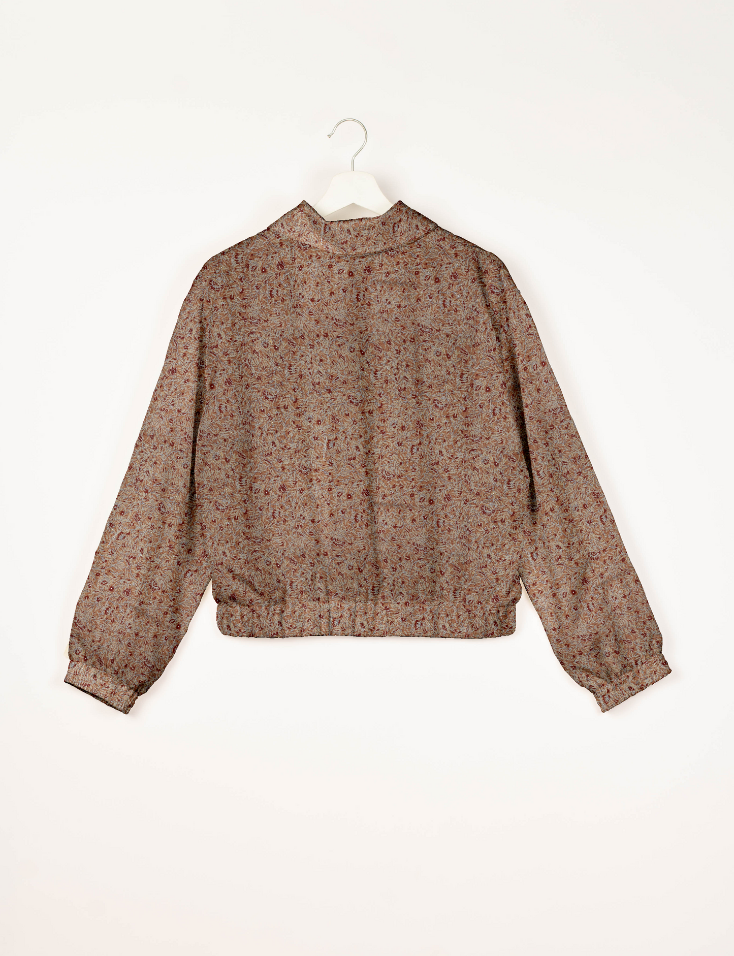 Upcycled Bomber Jacket made from recycled sari materials, featuring a cute cropped shape, elasticated hem and cuffs, and contrast sari print lining. Sustainable apparel promoting eco-friendly fashion and ethical clothing.