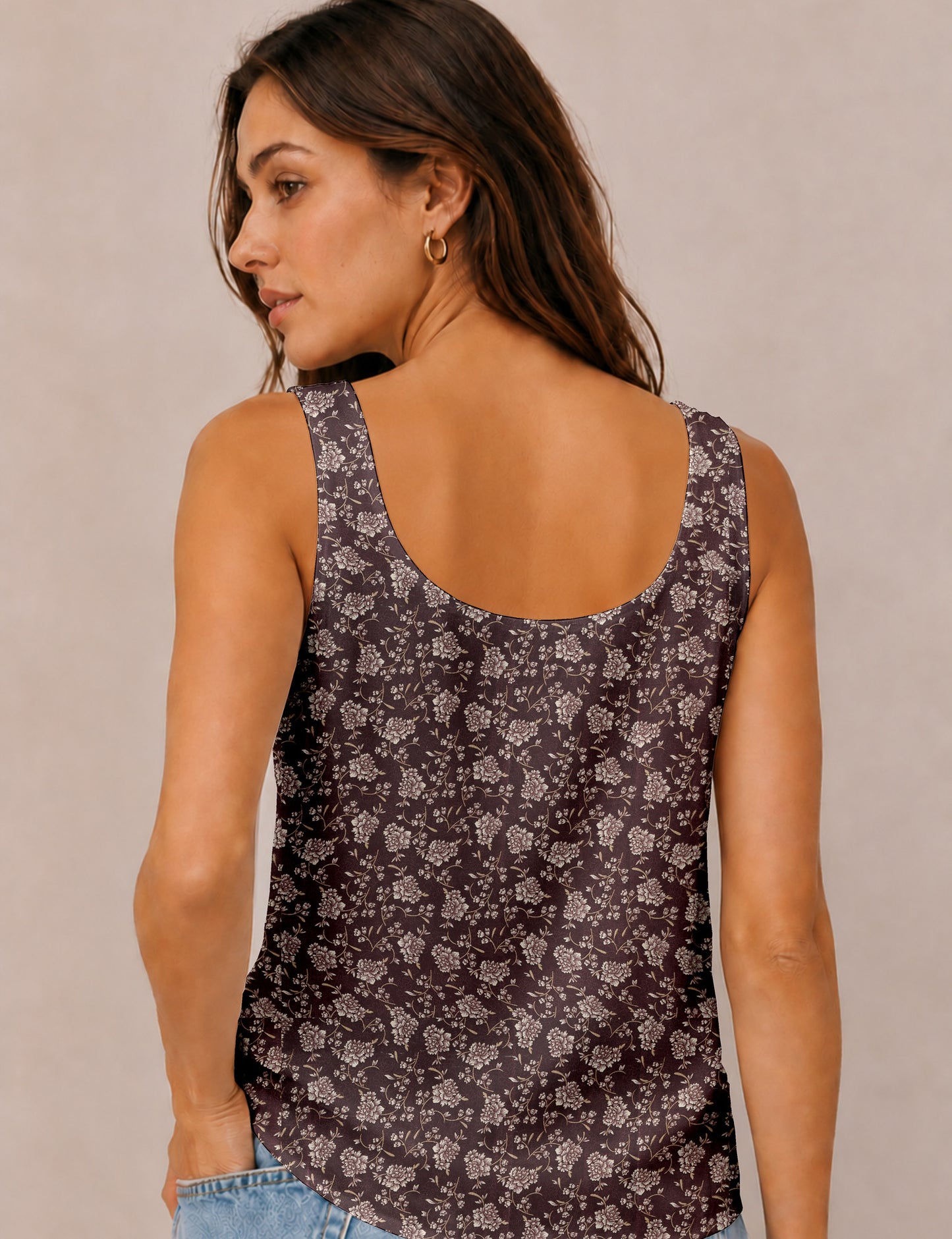 Women's sleeveless blouse with a relaxed straight fit, wide scoop neckline, deep scoop back, and hip-length silhouette.