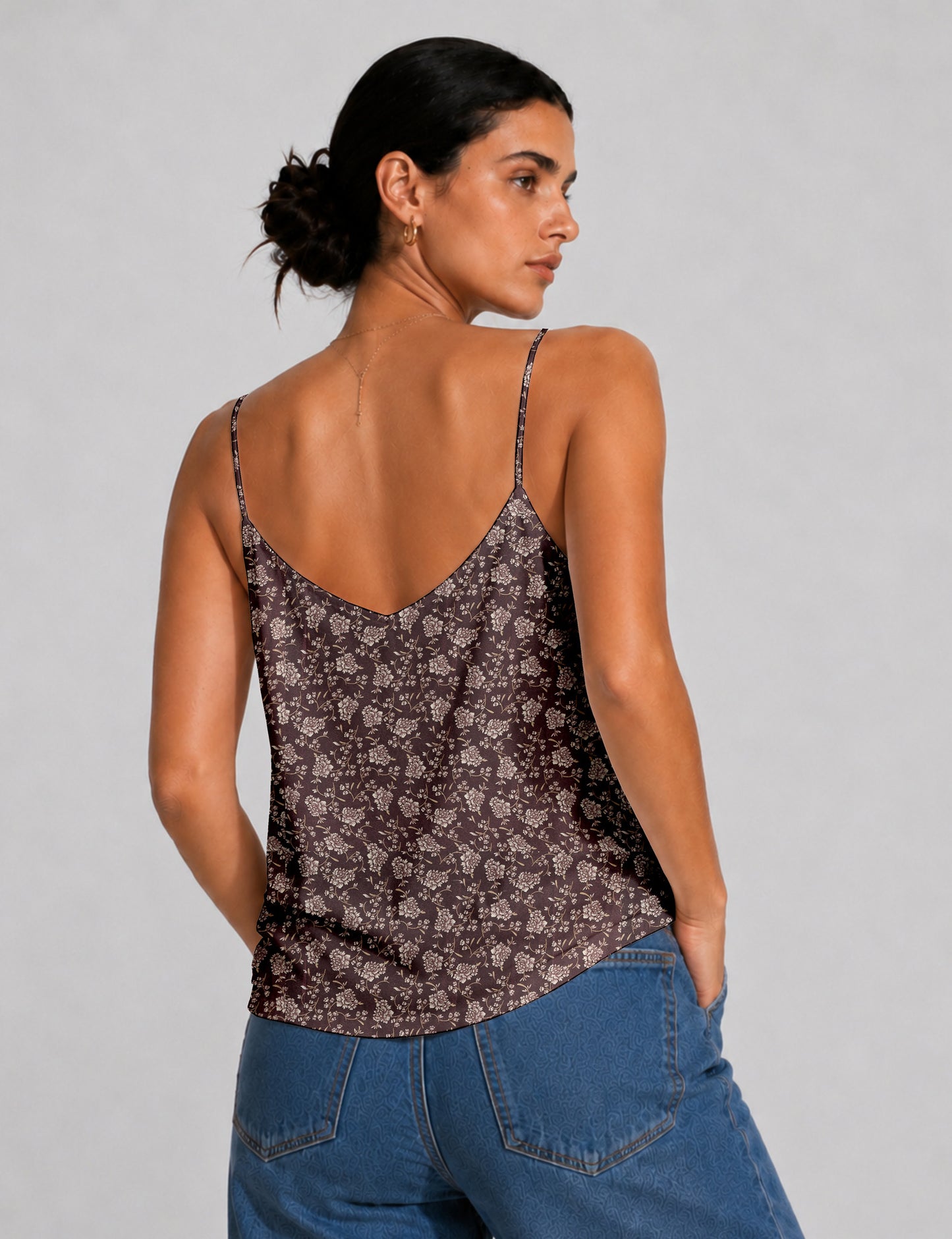 Women's sleeveless slip top with a relaxed straight fit, soft V-neckline, deep V-back, and delicate spaghetti straps.