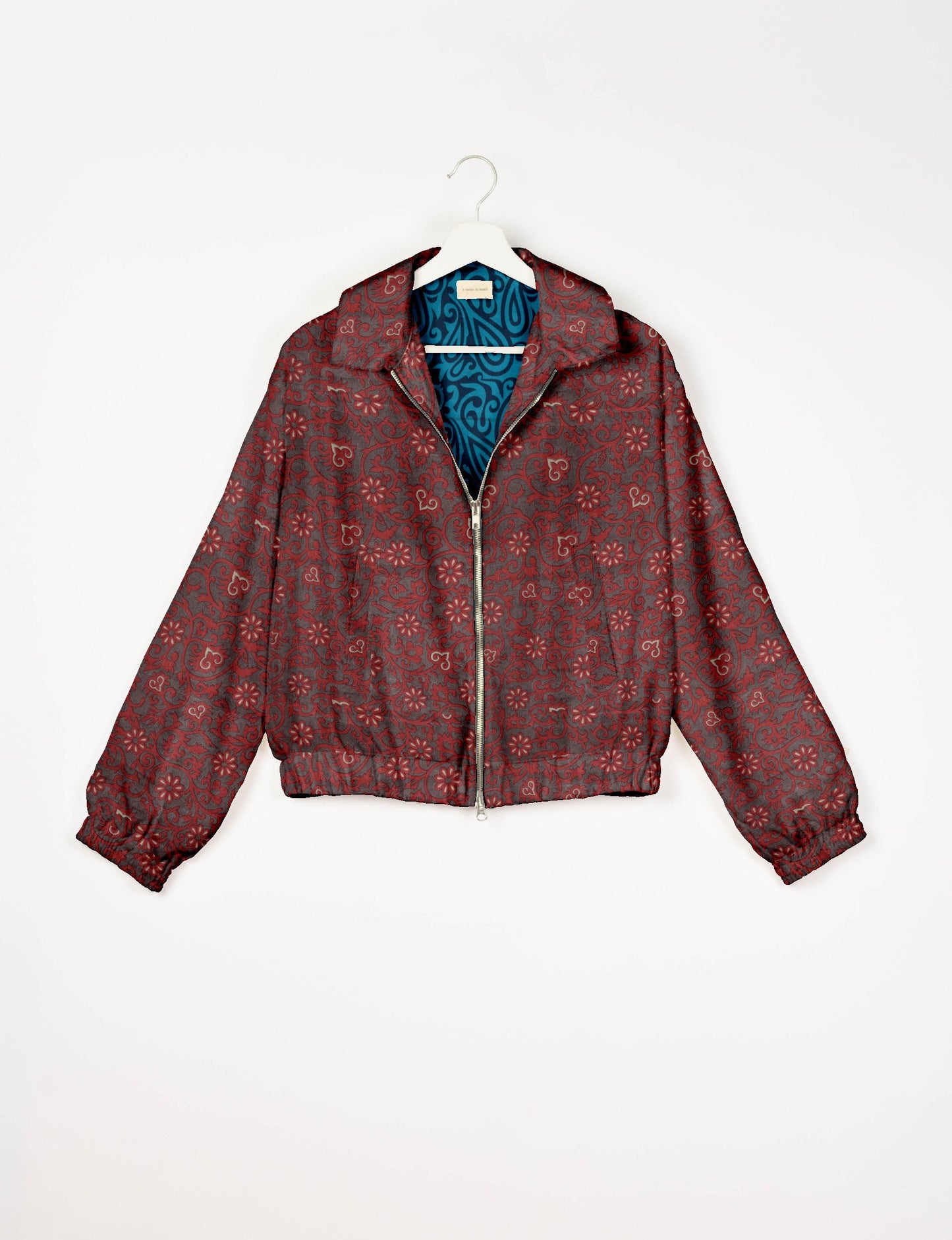 Upcycled Bomber Jacket made from recycled sari materials, featuring a cute cropped shape, elasticated hem and cuffs, and contrast sari print lining. Sustainable apparel promoting eco-friendly fashion and ethical clothing.