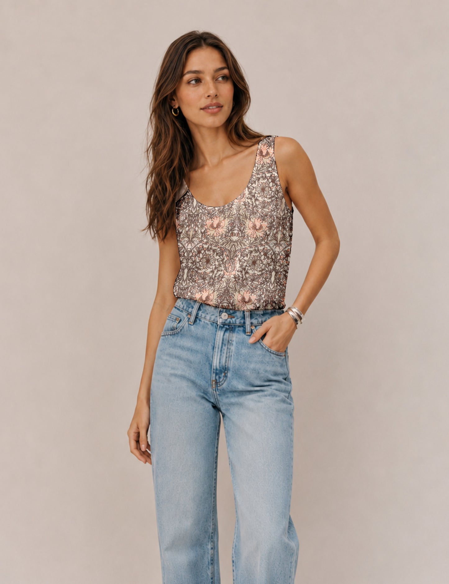 Women's sleeveless blouse with a relaxed straight fit, wide scoop neckline, deep scoop back, and hip-length silhouette.