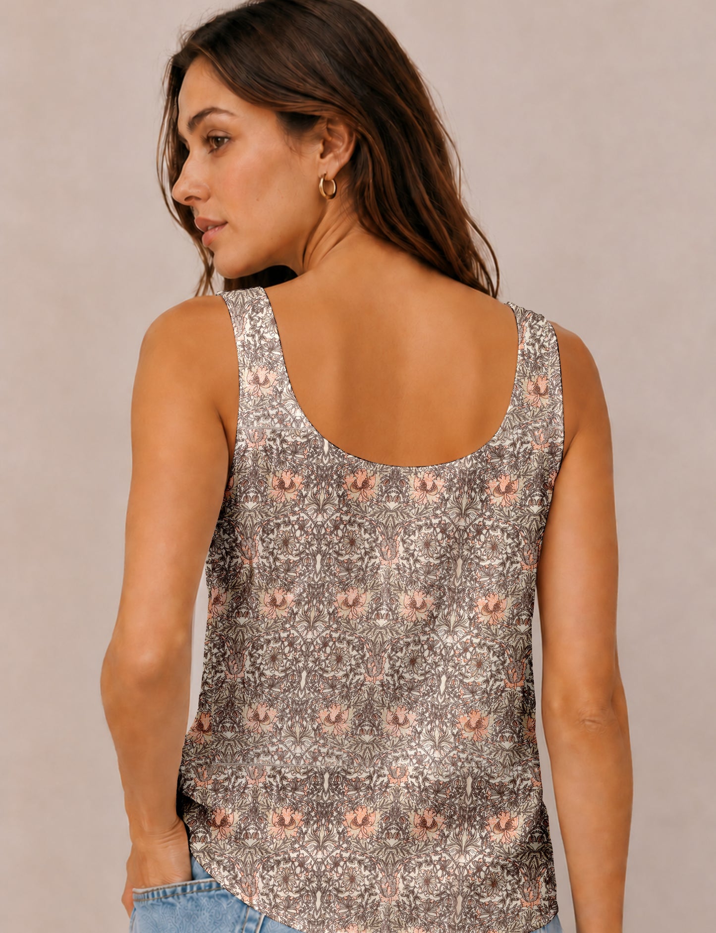 Women's sleeveless blouse with a relaxed straight fit, wide scoop neckline, deep scoop back, and hip-length silhouette.