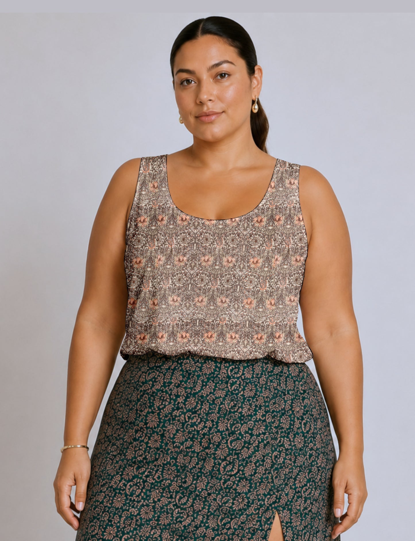 Women's sleeveless blouse with a relaxed straight fit, wide scoop neckline, deep scoop back, and hip-length silhouette.
