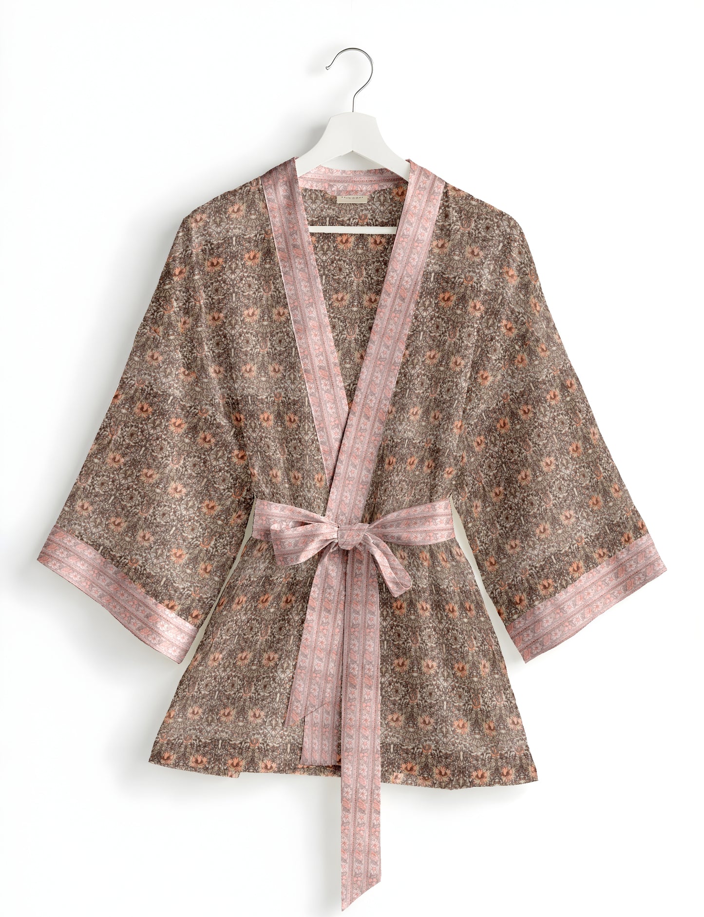 Short kimono robe with wrap front, V-neckline, wide sleeves, waist tie, and concealed skort detail.