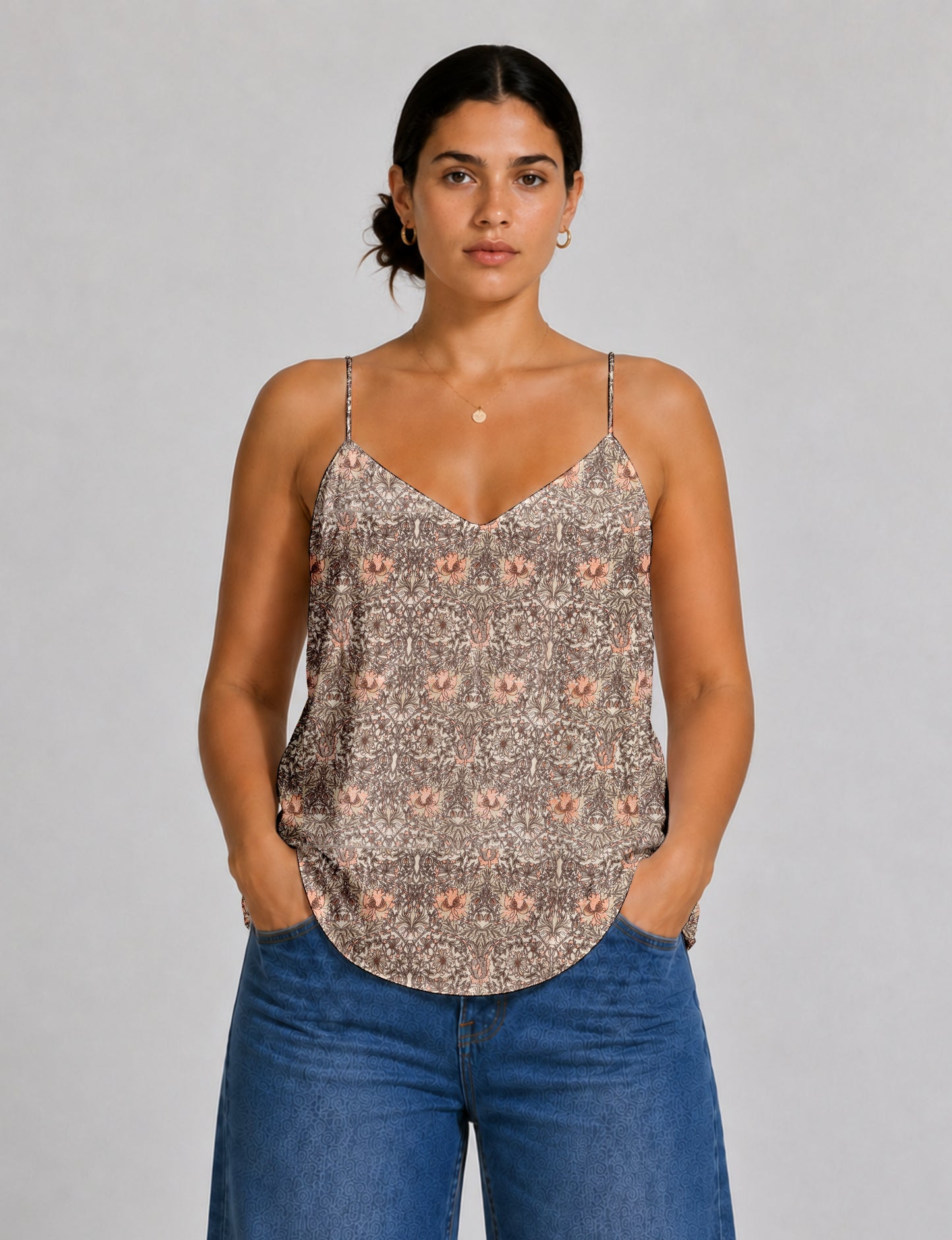 Women's sleeveless slip top with a relaxed straight fit, soft V-neckline, deep V-back, and delicate spaghetti straps.