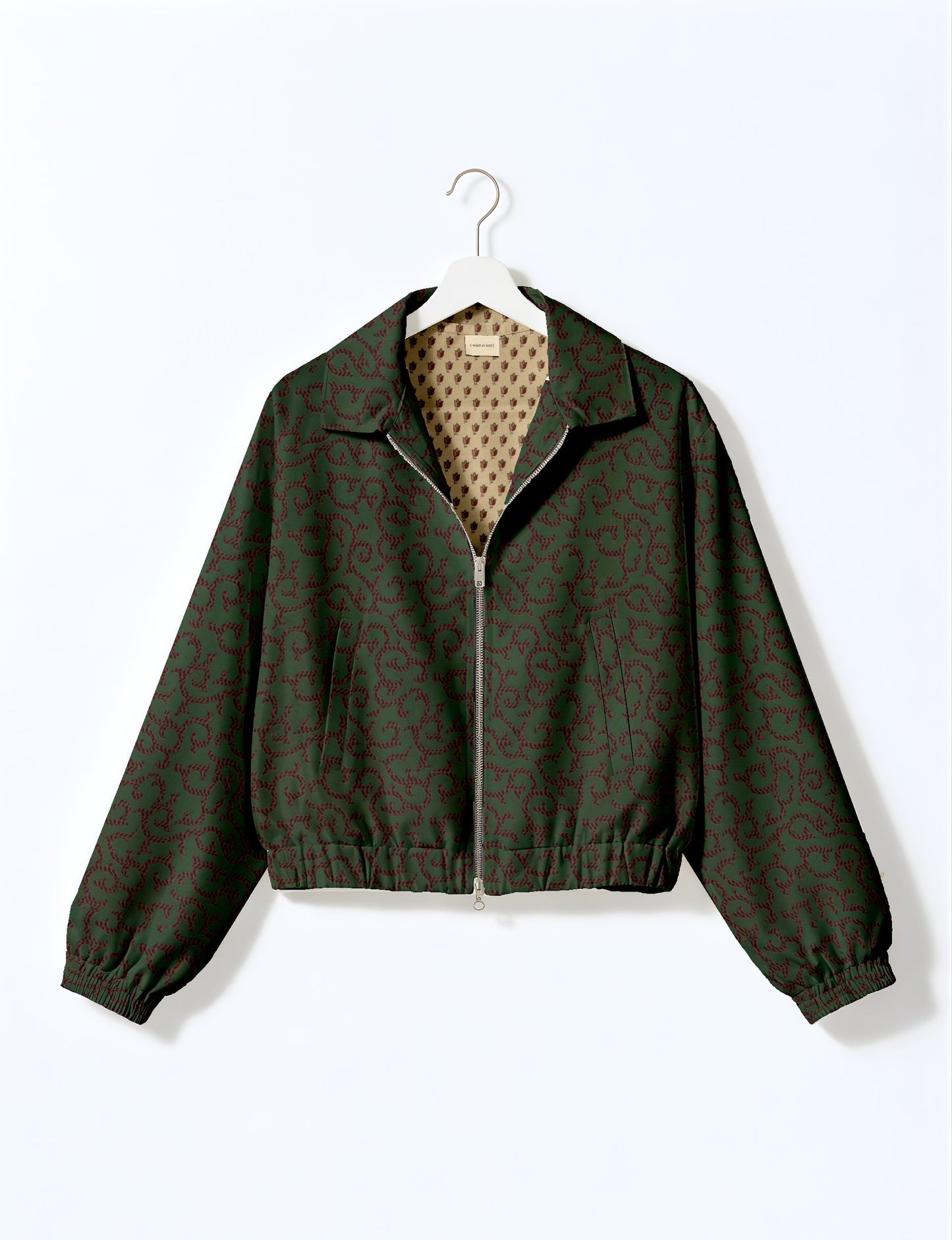 Upcycled Bomber Jacket made from recycled sari materials, featuring a cute cropped shape, elasticated hem and cuffs, and contrast sari print lining. Sustainable apparel promoting eco-friendly fashion and ethical clothing.