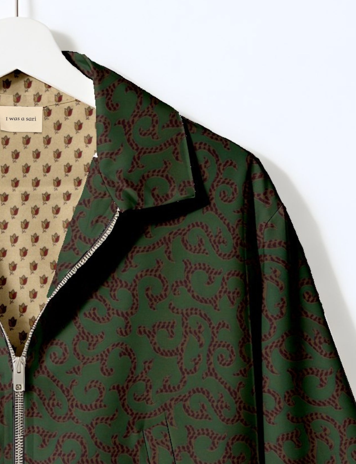 Upcycled Bomber Jacket made from recycled sari materials, featuring a cute cropped shape, elasticated hem and cuffs, and contrast sari print lining. Sustainable apparel promoting eco-friendly fashion and ethical clothing.