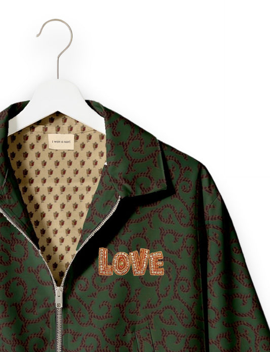 Love Bomber Jacket made from recycled fabric, featuring hand-stitched Aari embroidery. A unique piece of zero-waste clothing, part of the circular fashion movement. Designed with upcycled materials for a stylish yet environmentally friendly clothing choice.