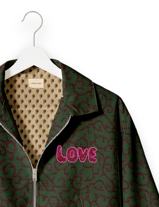 Love Bomber Jacket made from recycled fabric, featuring hand-stitched Aari embroidery. A unique piece of zero-waste clothing, part of the circular fashion movement. Designed with upcycled materials for a stylish yet environmentally friendly clothing choice.